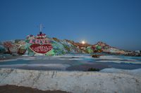 Salvation Mountain, with the moon rising, in 2008.